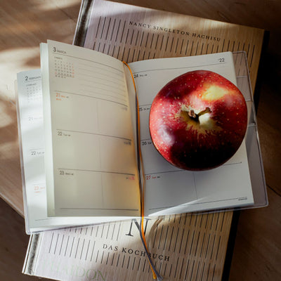 Wochenplan mit Apfel